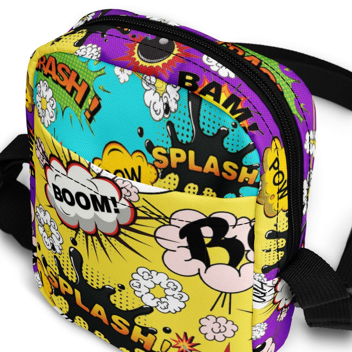 Whether you're a teen looking to add some fun to your outfit or a mom who loves playful accessories, the Comic Cross Body Bag is the perfect way to carry your essentials in style.