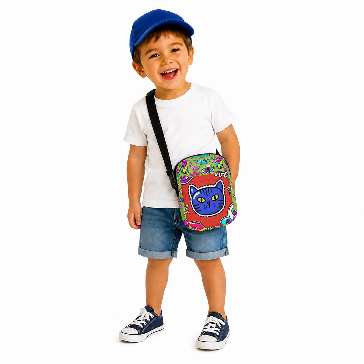 This cat face crossbody bag is fun on-the-go bag adds a playful design and cool style to every adventure. SHOP Now at The Wishful Fish Kids